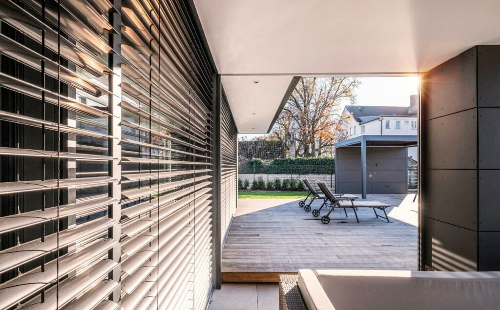 Rail Guided External Venetian Blind on the garden area of a house